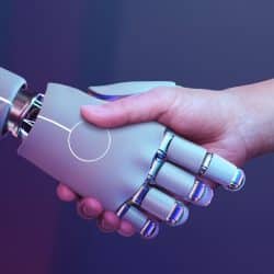 Image illustrant la collaboration entre un humain et une intelligence artificielle à travers une poignée de main.