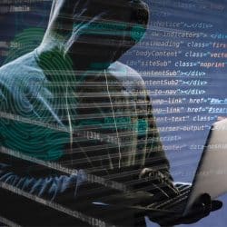 Image illustrant une cyberattaque par phishing avec un hacker anonyme encapuchonné manipulant un ordinateur.